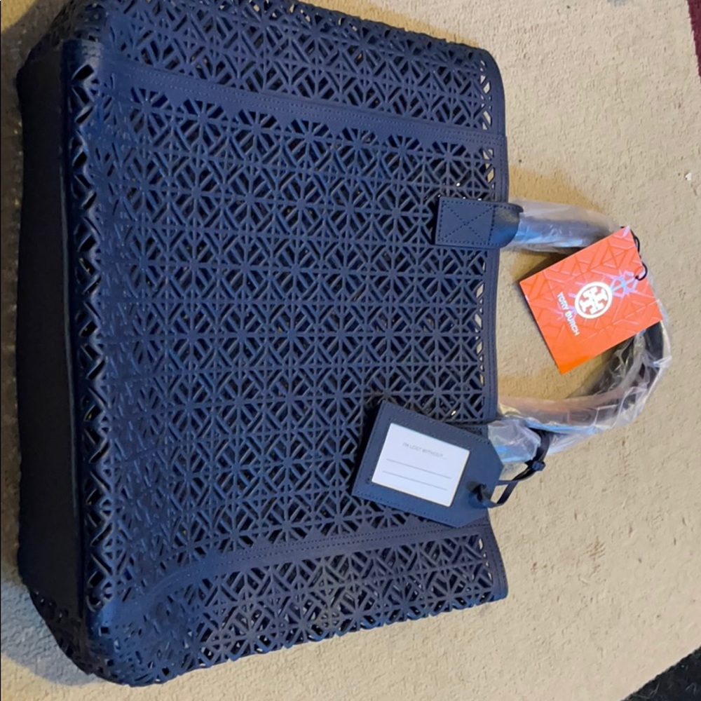 Tory Burch laser cut out tote with luggage tag